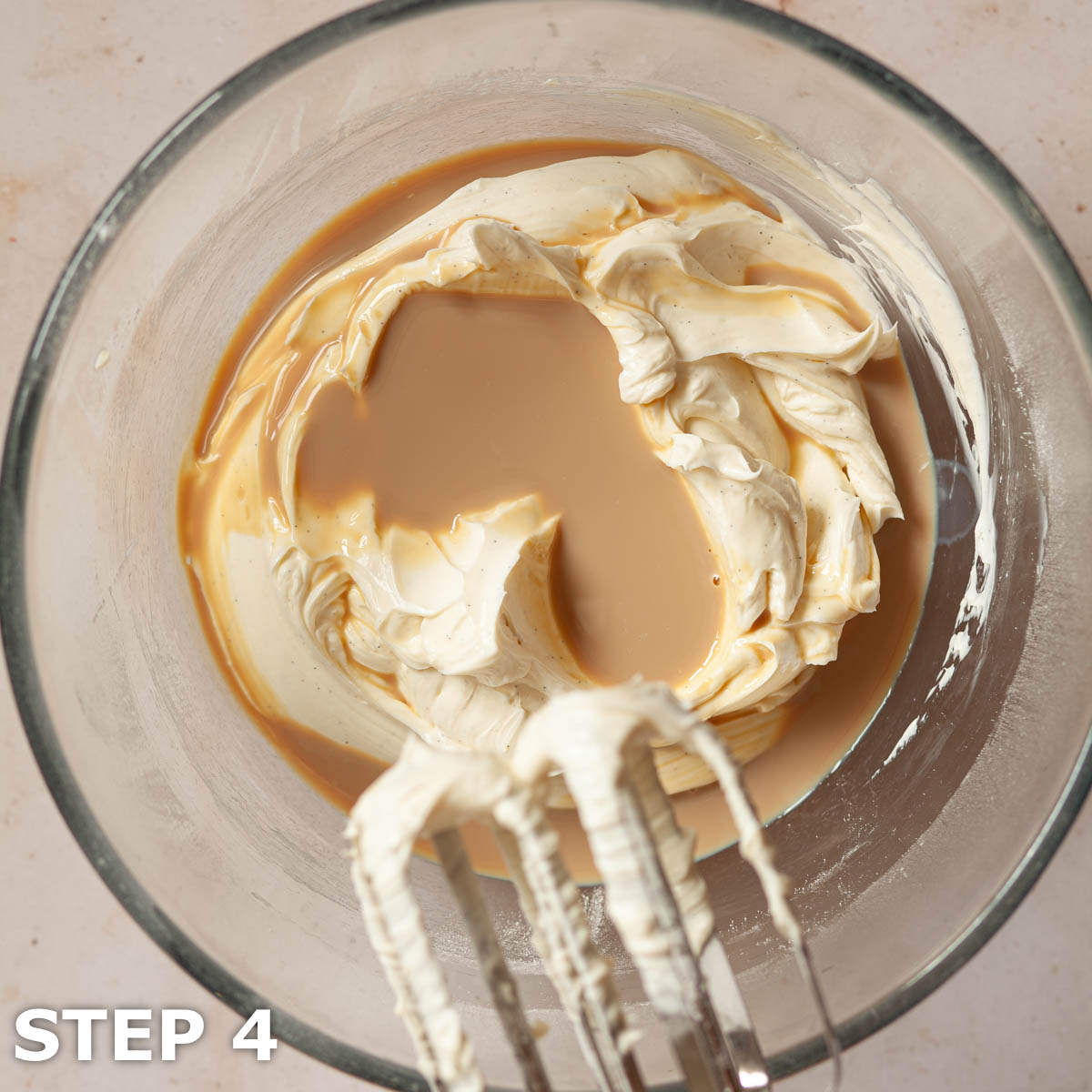 Baileys Irish cream being added to no cook cheesecake batter.