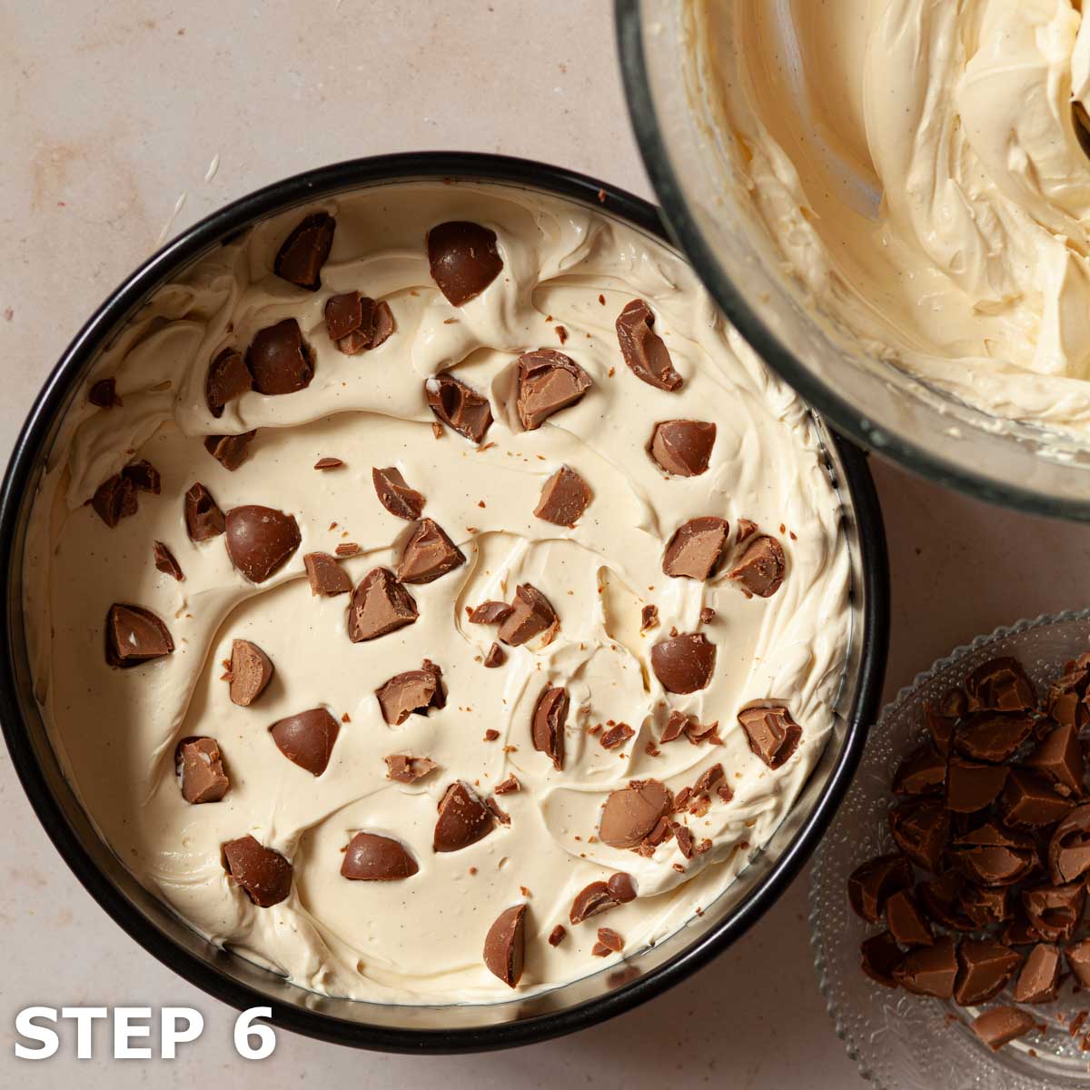 A layer of chocolate pieces being added to an Irish cream no bake cheesecake.