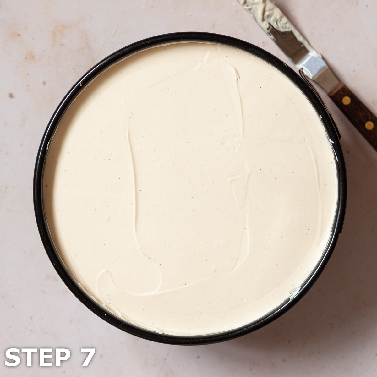 Undecorated Baileys no cook cheesecake in a baking tin.