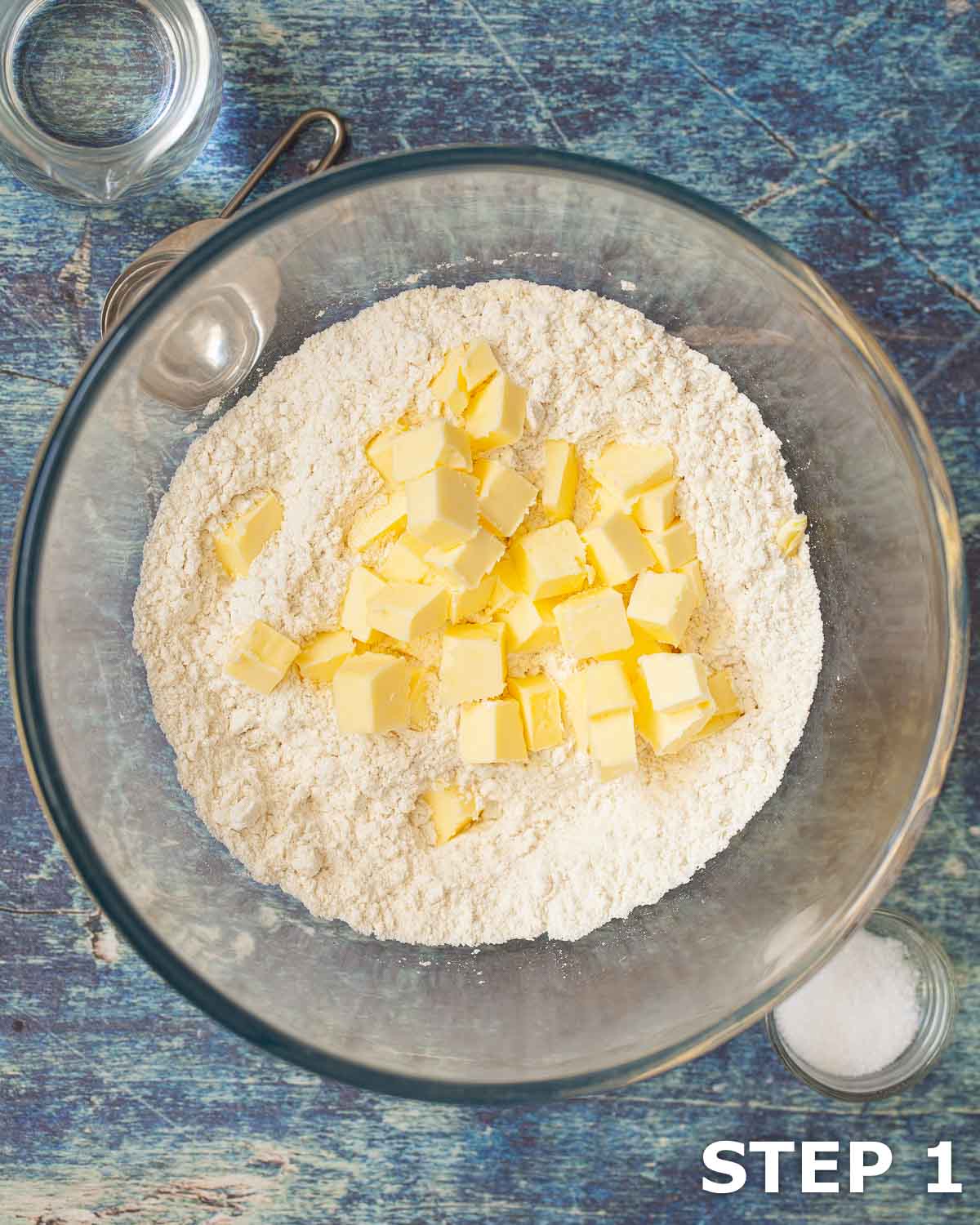Flour and cubed butter in a mixing bowl.