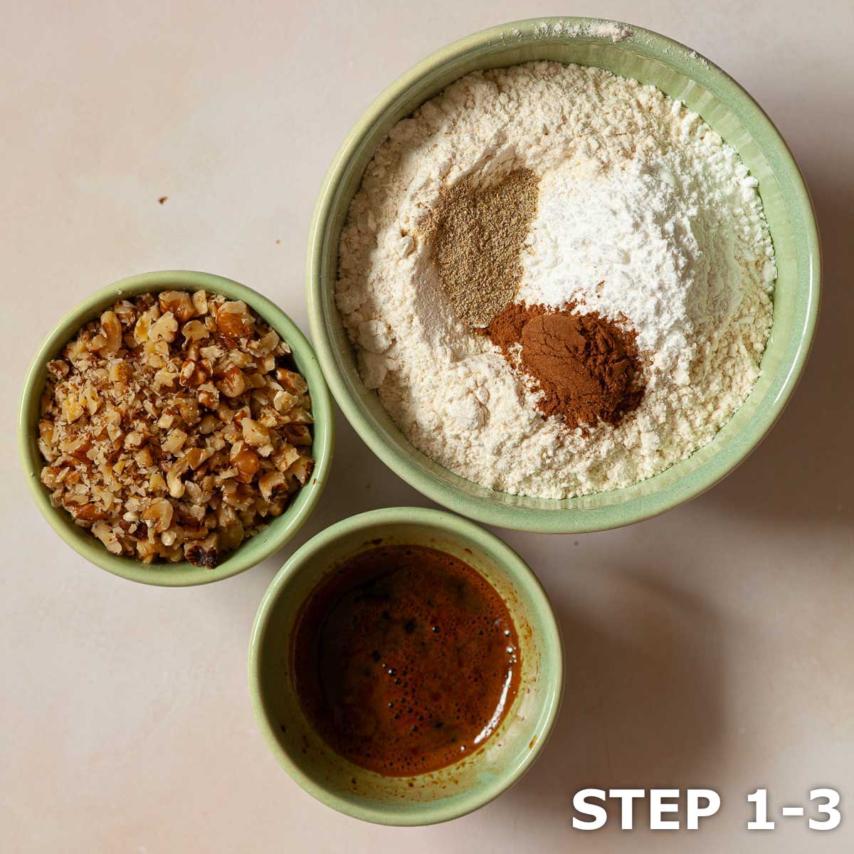 Bowls of coffee, flour & spices and chopped walnuts weighted out for a cake.
