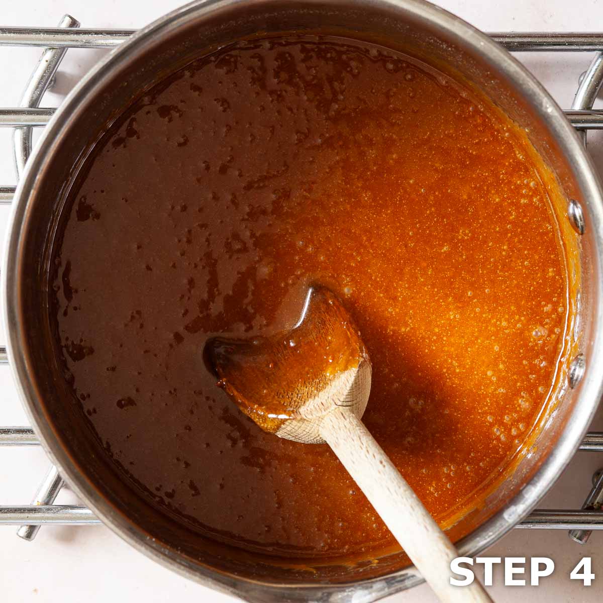 Melted butter, syrup, sugar and Biscoff spread in a saucepan for flapjack.