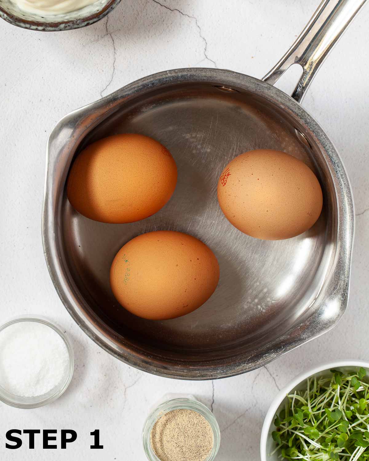 Three eggs in a saucepan.