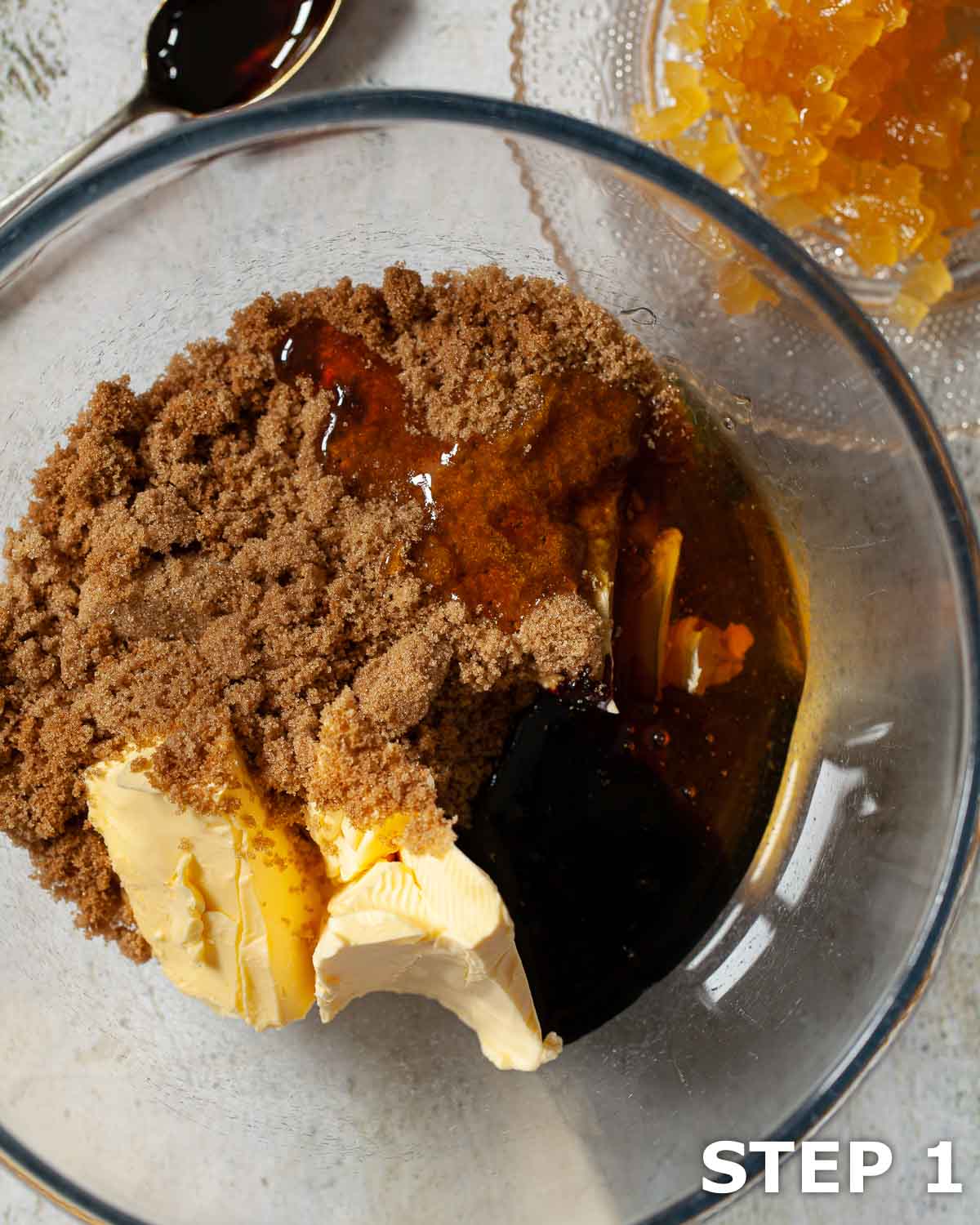 Butter, brown sugar syrup and treacle in a mixing bowl.