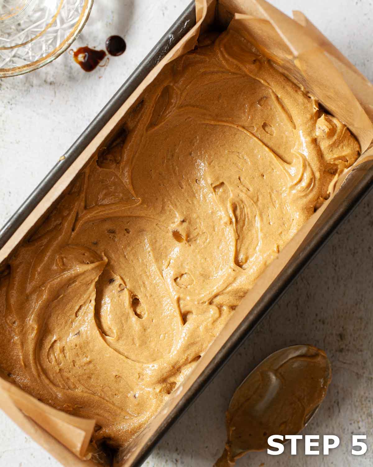 Cake batter in a loaf tin.