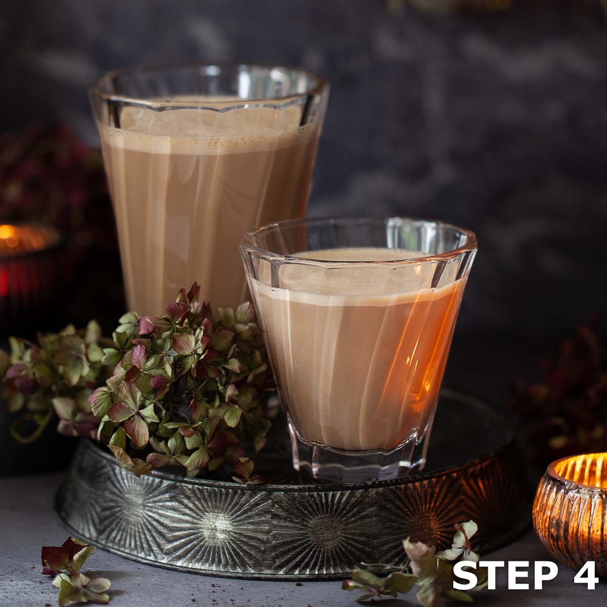 Two Irish lattes in heatproof coffee glasses.