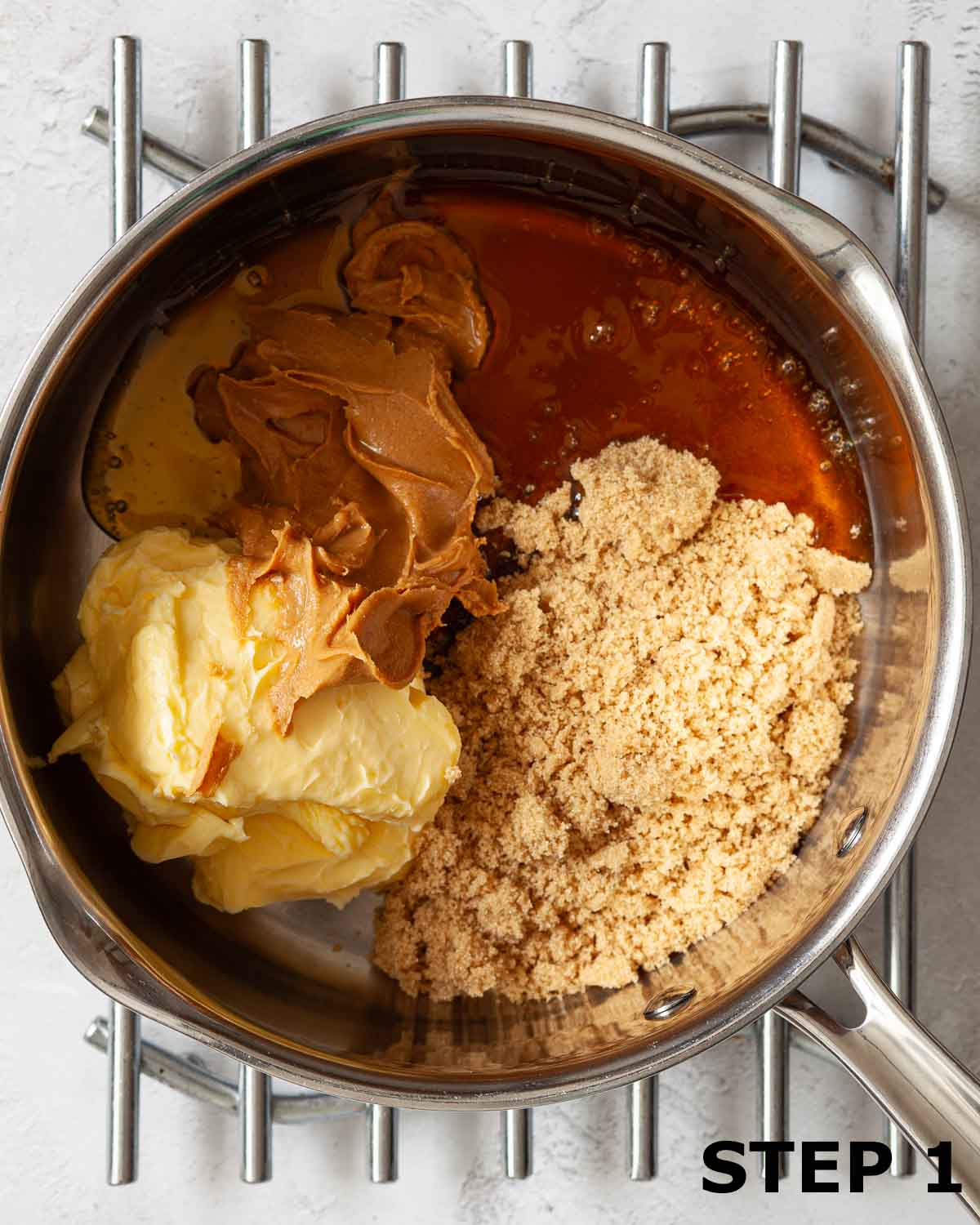 Butter, brown sugar, golden syrup and peanut butter in a pan.