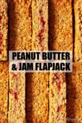 Slices of British flapjack with peanut butter and jam with text overlay.