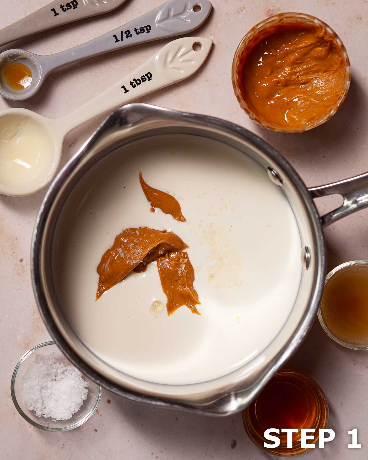 Ingredients for peanut butter liqueur in a pan.