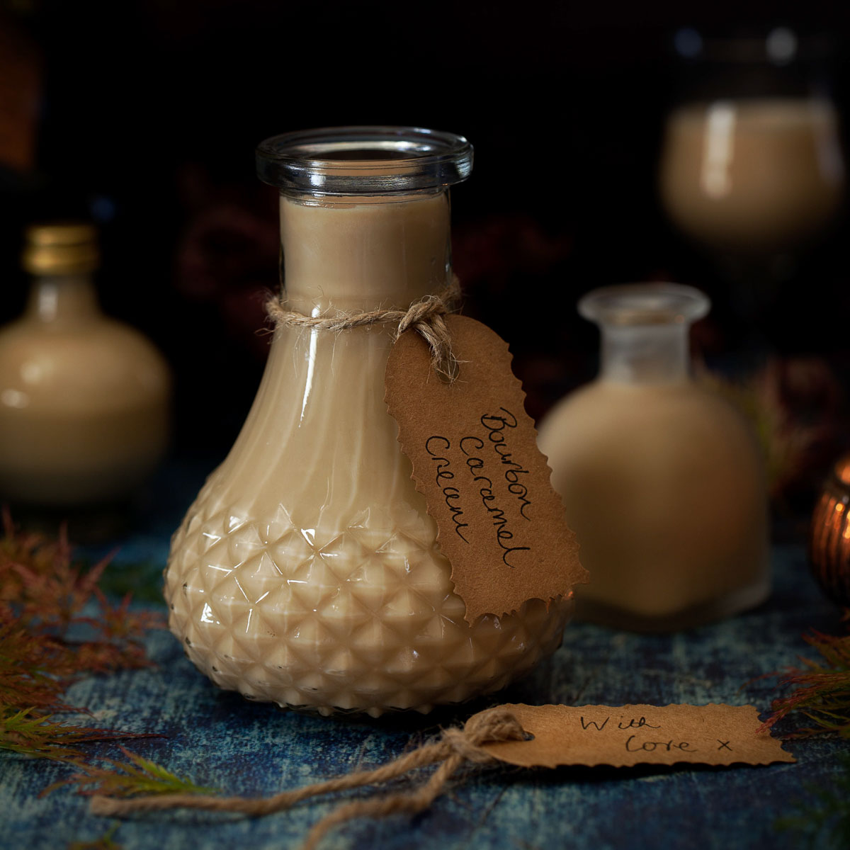 A bottle of bourbon caramel cream liqueur with a label on it.