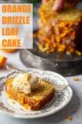 A plated slice of orange and poppy seeds cake topped with clotted cream with text overlay.