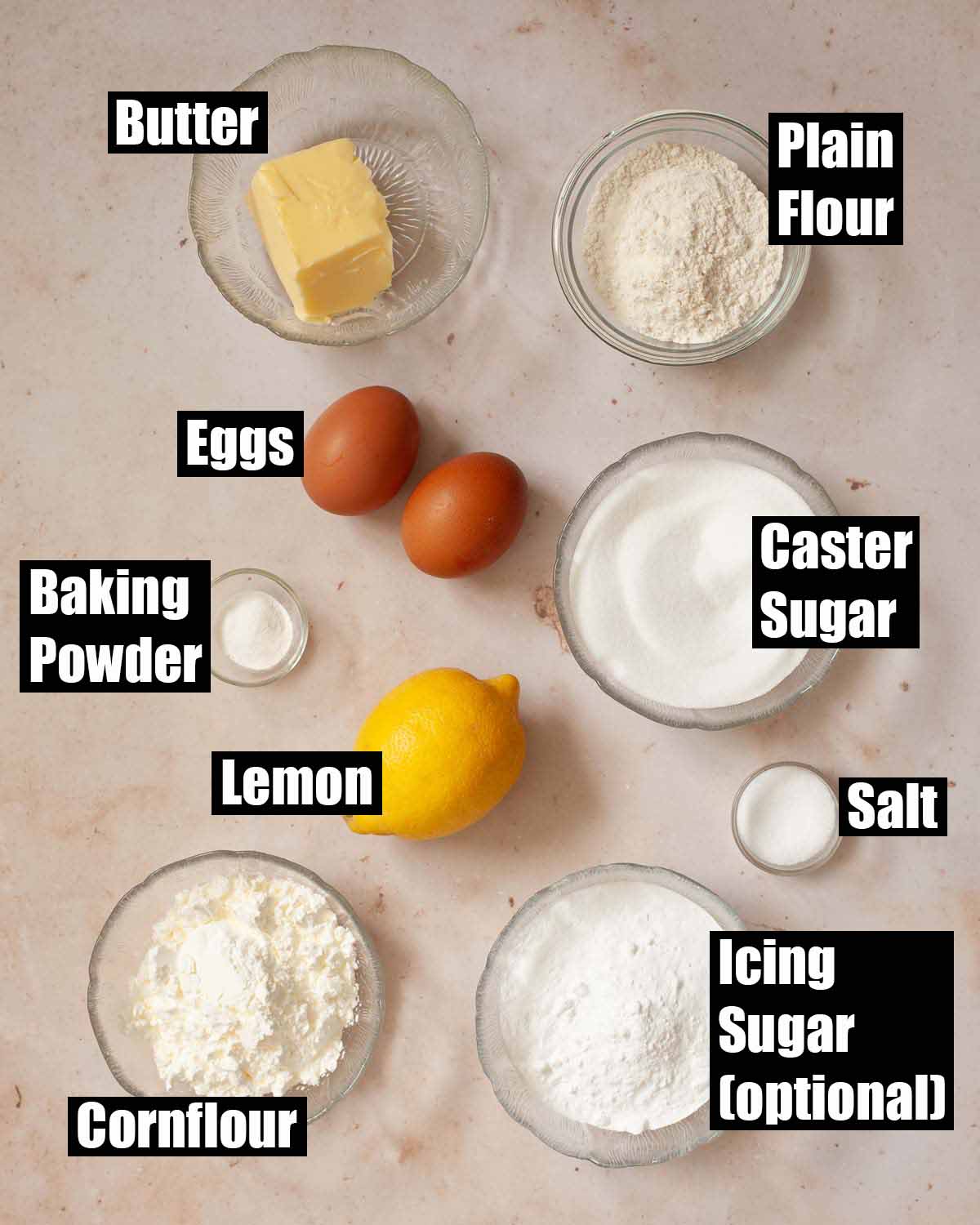 Labelled ingredients for sand cake with cornflour.