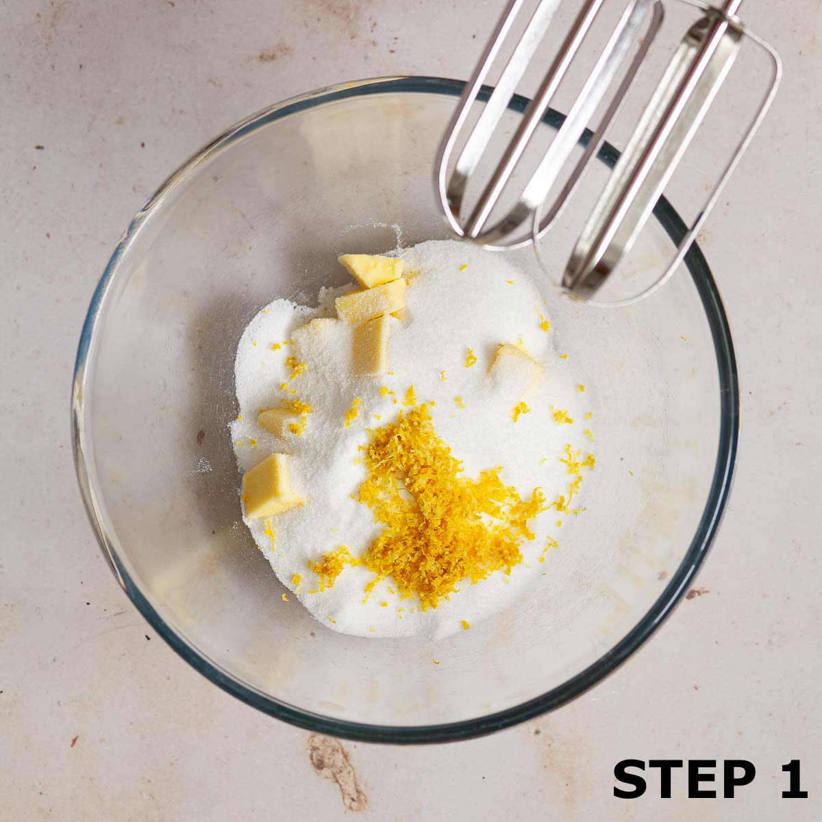 Butter, sugar and lemon zest in a mixing bowl.