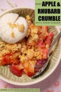 A bowl of apple rhubarb crumble topped with ice cream with text overlay.