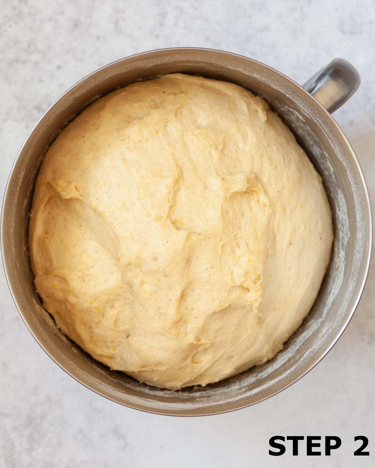 Enriched dough in a mixing bowl that has proved to double in size.