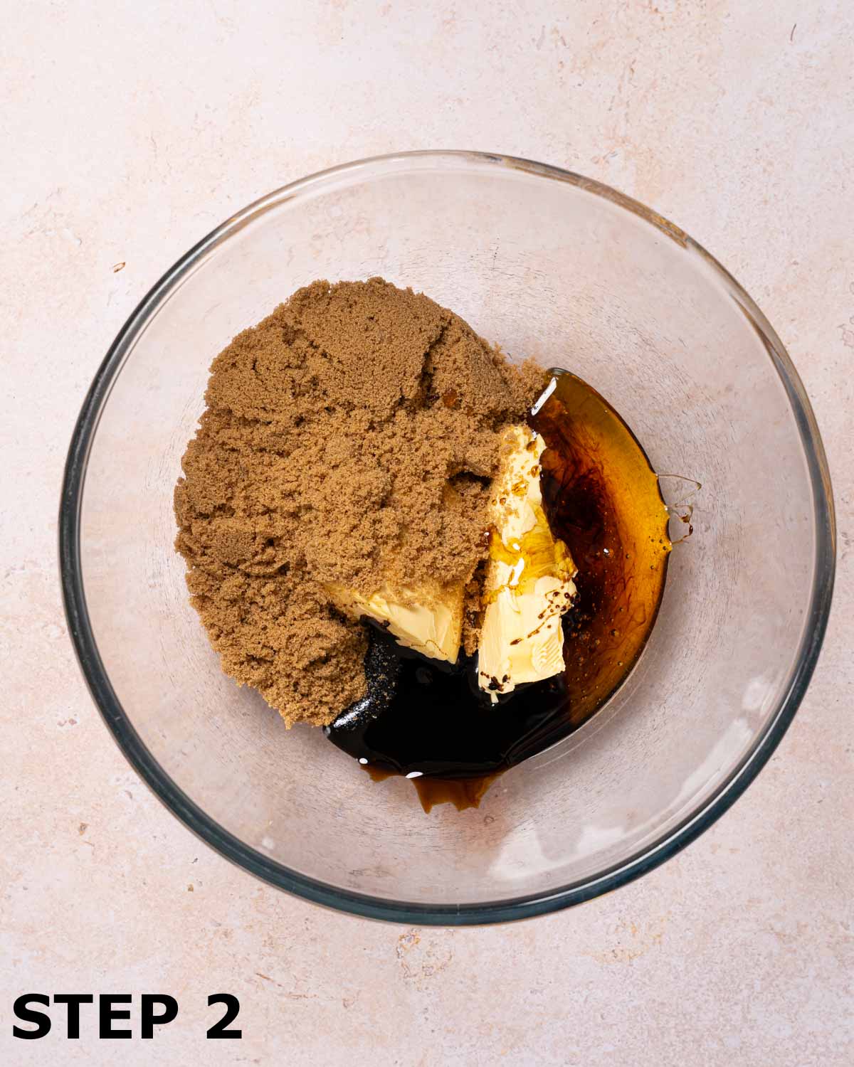 Butter, brown sugar, black treacle and golden syrup in a mixing bowl.