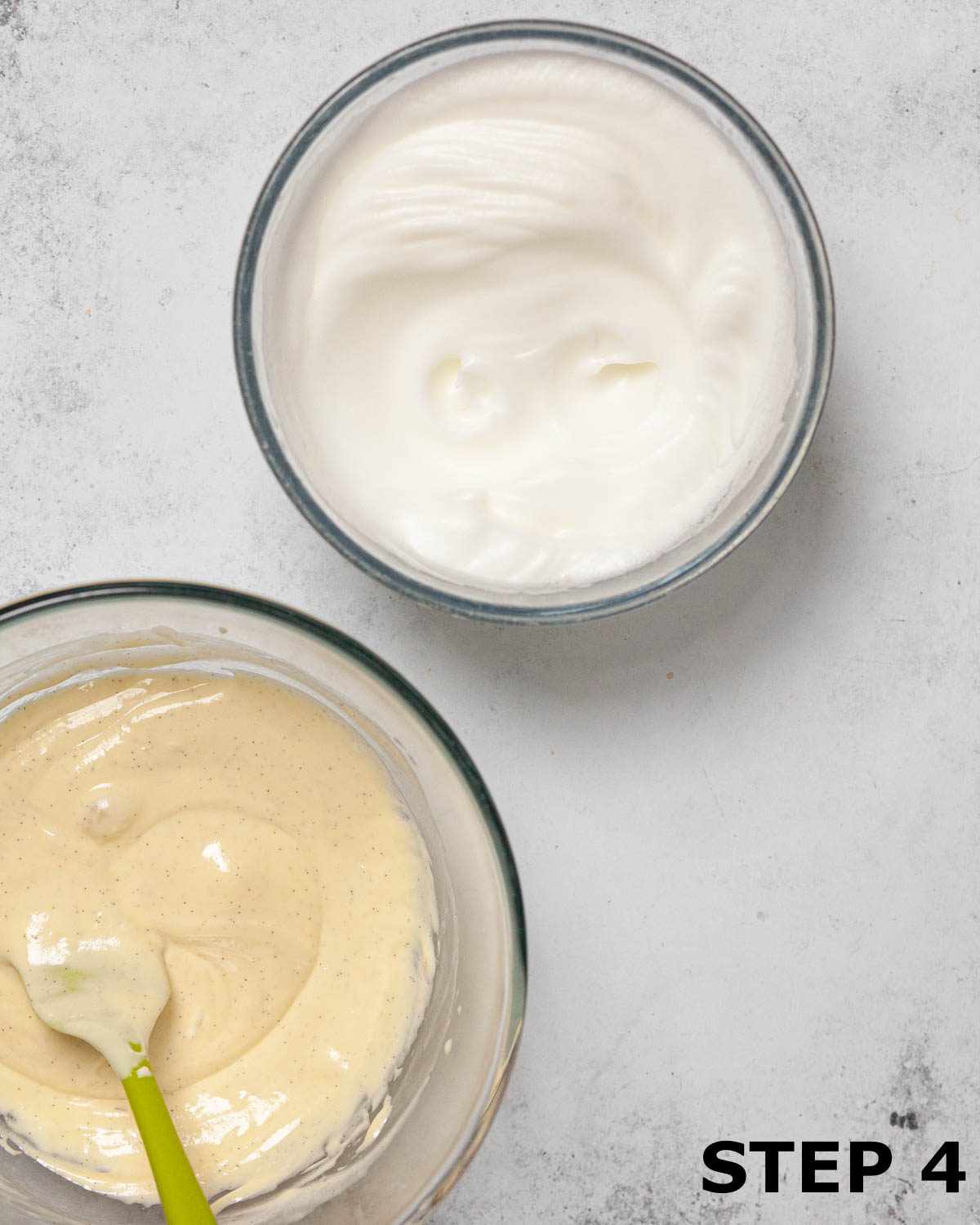 Bowls of whisked egg white and white chocolate ganache.