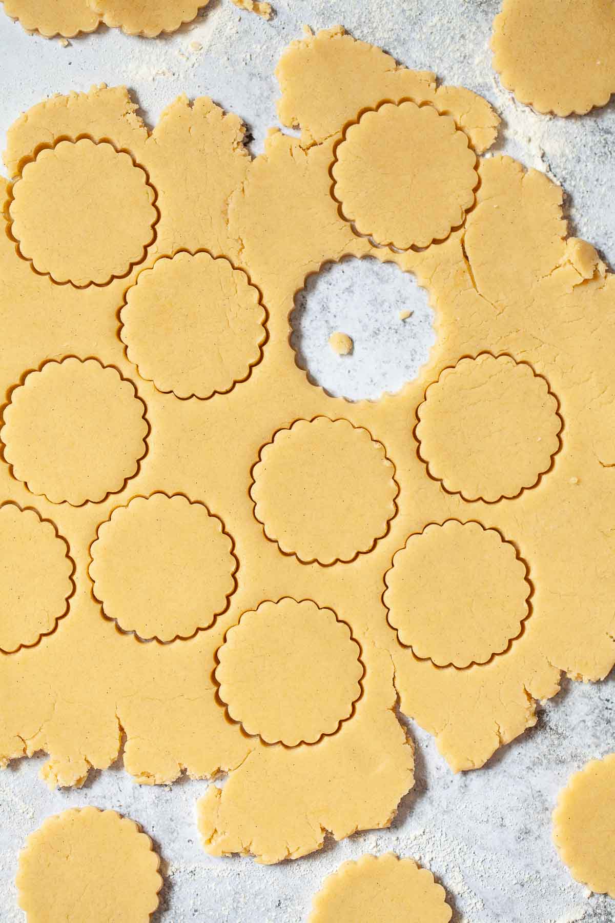 Biscuit dough rolled out and stamped into fluted circles.