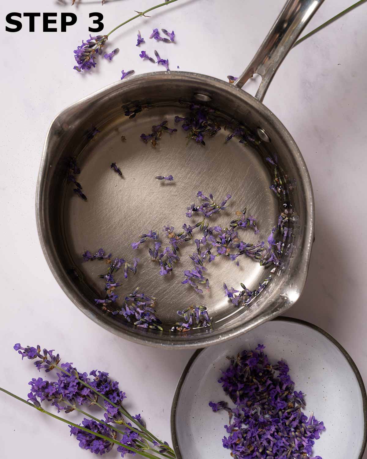 Lavender buds infusing in simple syrup.