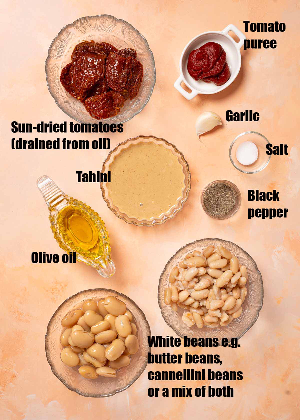 Labelled ingredients for white bean dip with sun-dried tomato.