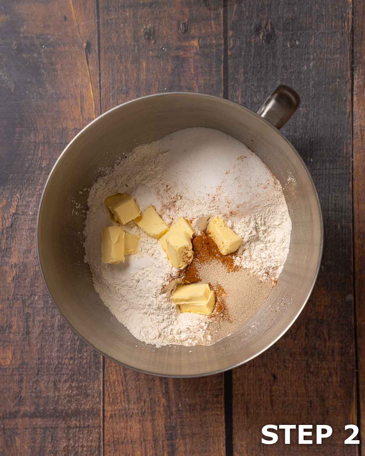 Dry ingredients for enriched dough in the bowl of a stand mixer.