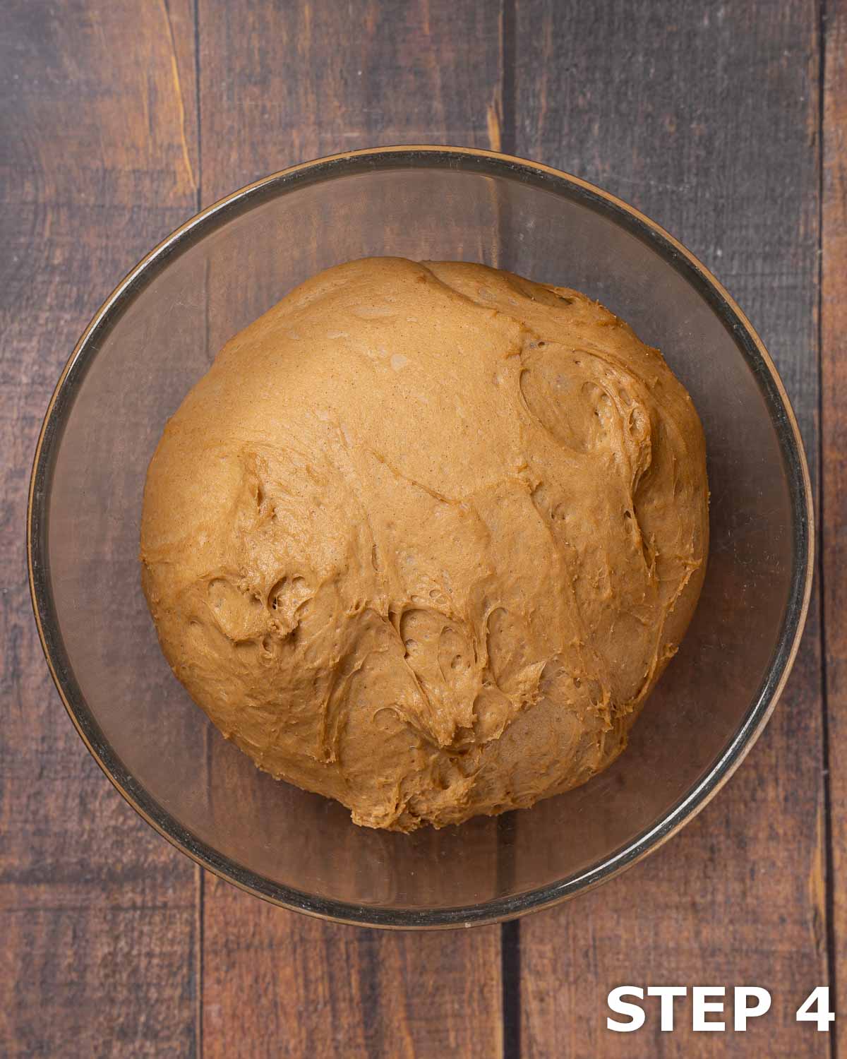 Dough for coffee cinnamon rolls in a bowl after the first prove.