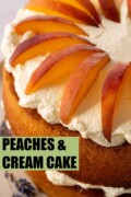 The top of a peaches and cream cake garnished with wedges of peach with text overlay.