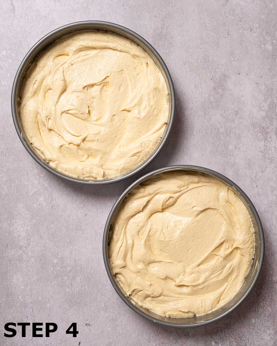 Cake batter in baking tins.