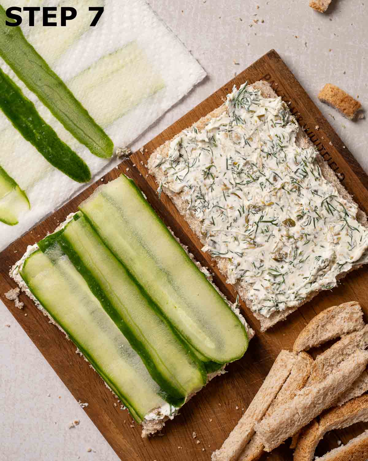 Cream cheese and cucumber tea sandwiches being assembled.