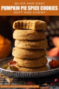 Labelled stack of soft chewy pumpkin cookies and the top one has a bite taken out.