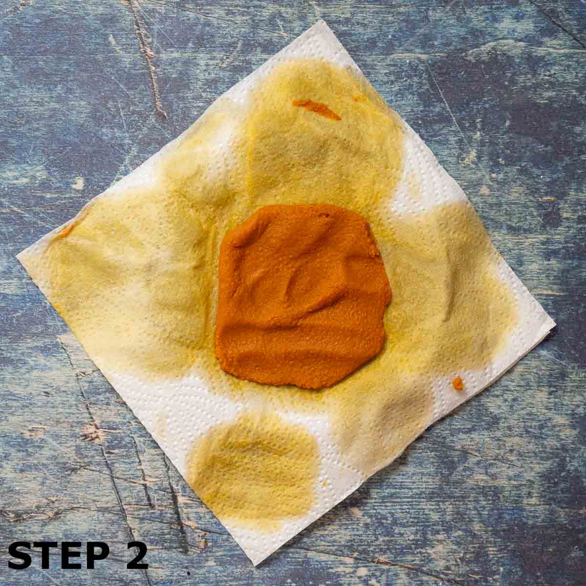 Pumpkin puree draining on kitchen paper.