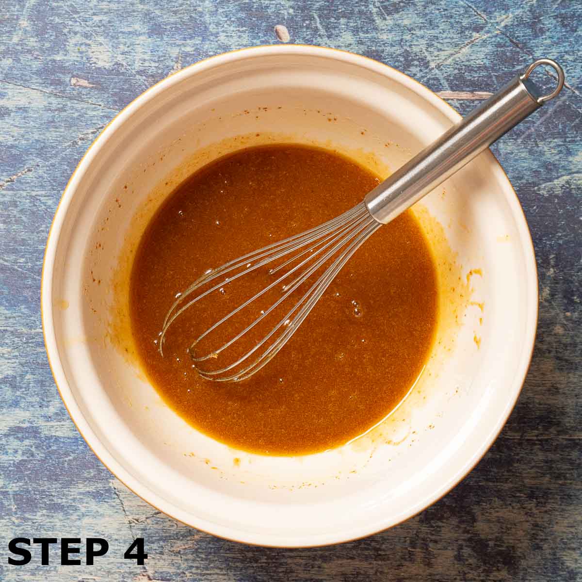 Wet ingredients mixed in a bowl for pumpkin pie spice cookies.